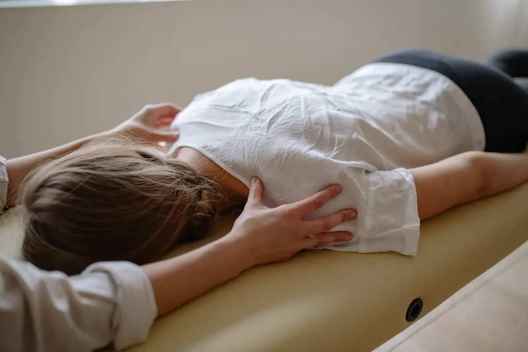 A hands-on shoulder assessment during an appointment